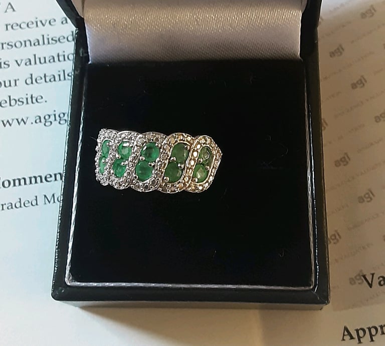 silver emerald ring, set with twelve round emeralds certificate for £290