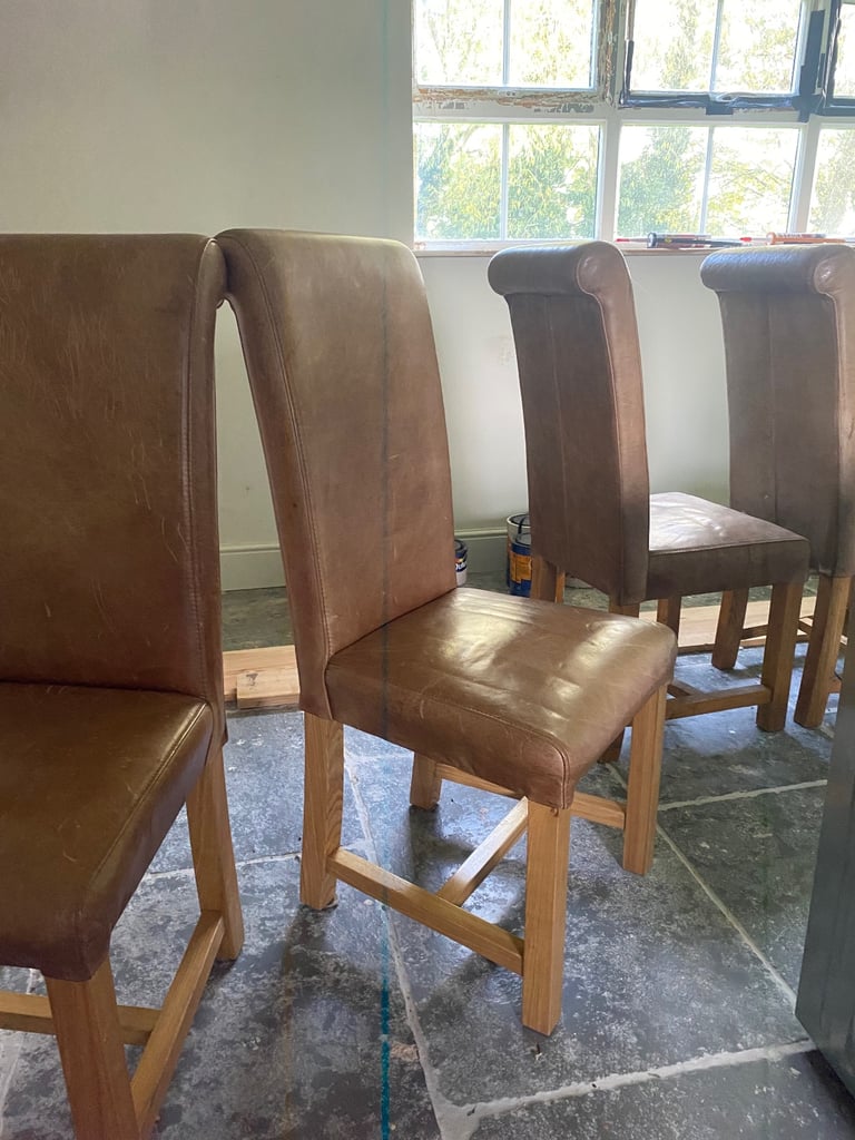 4 Tan leather and wood dining chairs