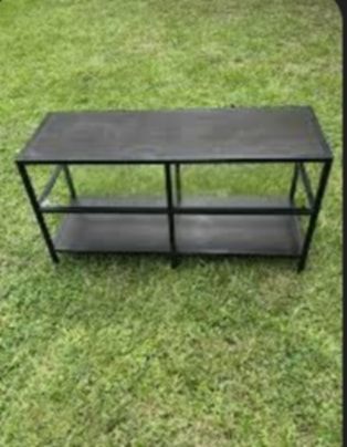 IKEA stand with a glass shelf