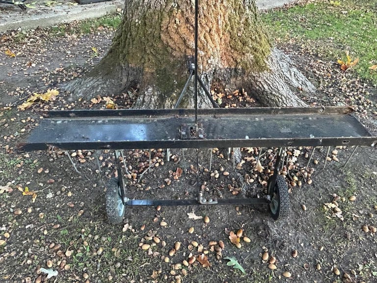 Ride on mower lawn aerator/scarifier