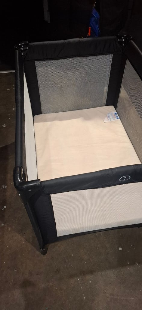 Travel cot with mattress and mattress topper 
