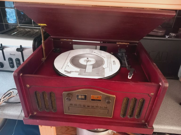 Vintage wooden Audio System. Plays Radio, Record and Cassette. Cd doesnt seem to play. 