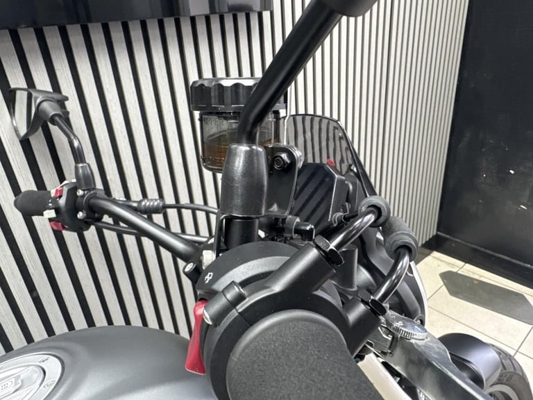 Voge ac525X in grey with yellow decals and only 211 Miles retro adventure