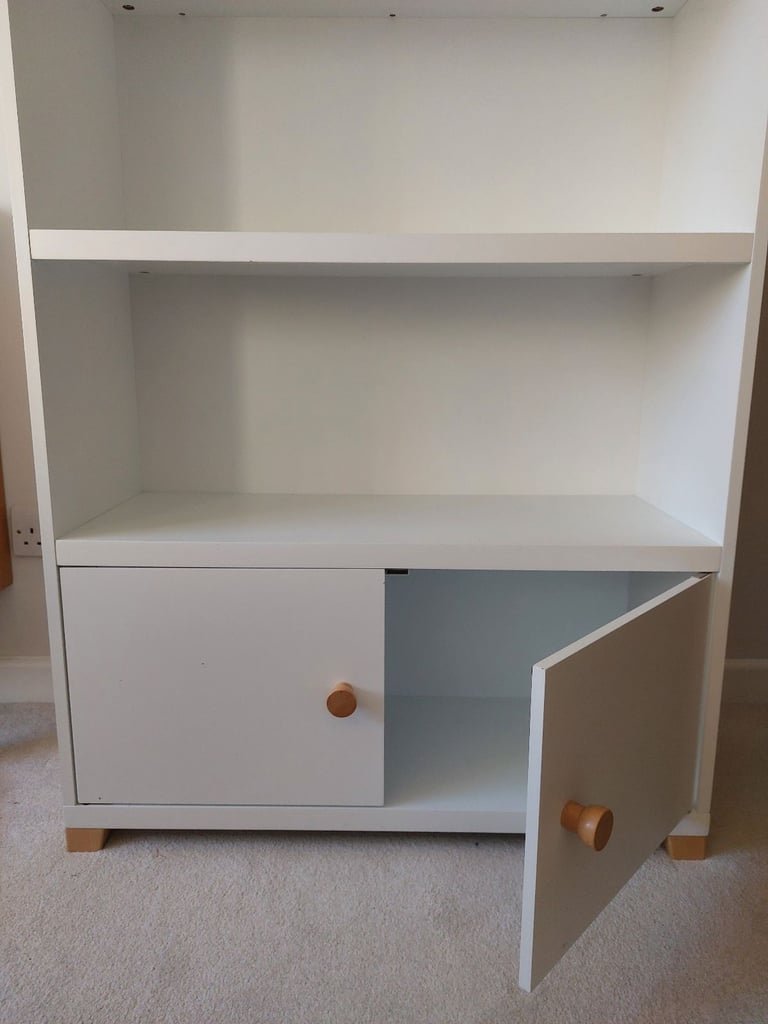 Child's room white bookcase with cupboard