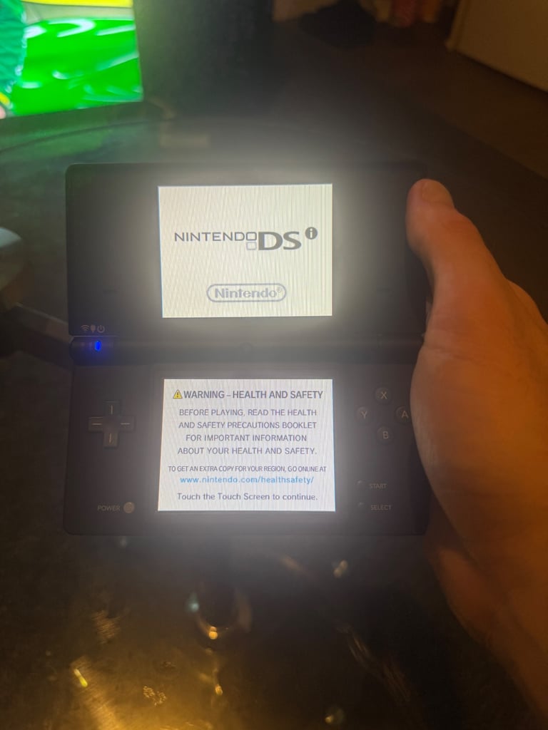 Great condition Nintendo DSI with 4 games, case and original stylus!