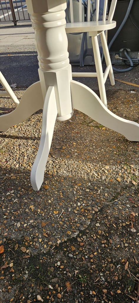 White farmhouse style round table and 4 chairs