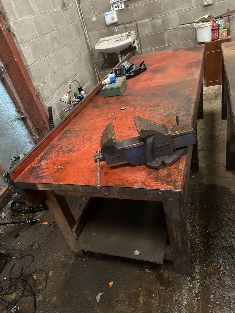 Two solid (aged) 8ft wood workbenches with vice 