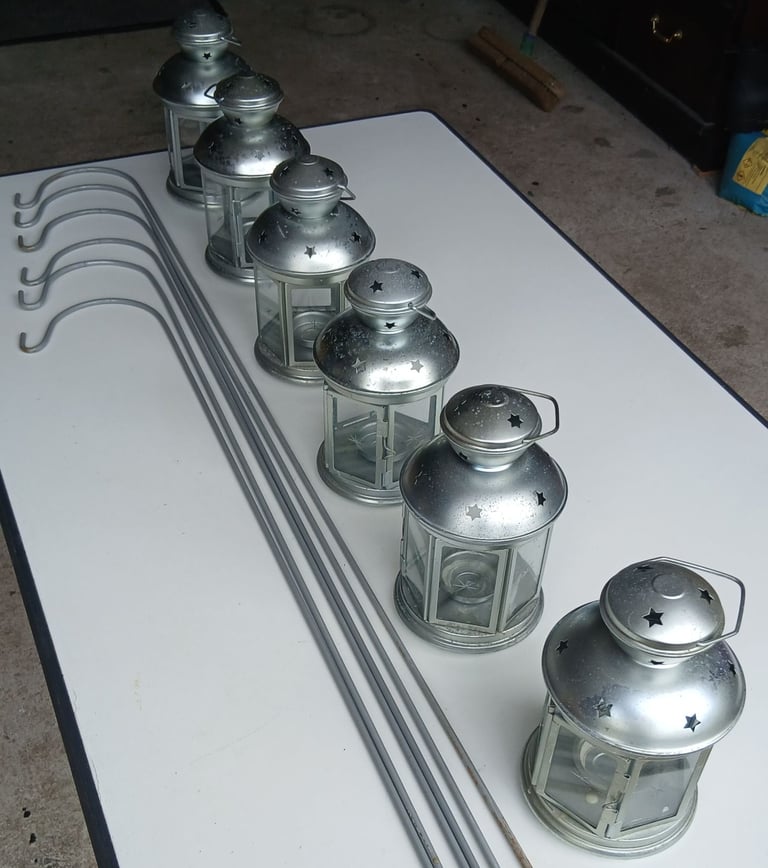 Six garden lanterns with six metal stakes