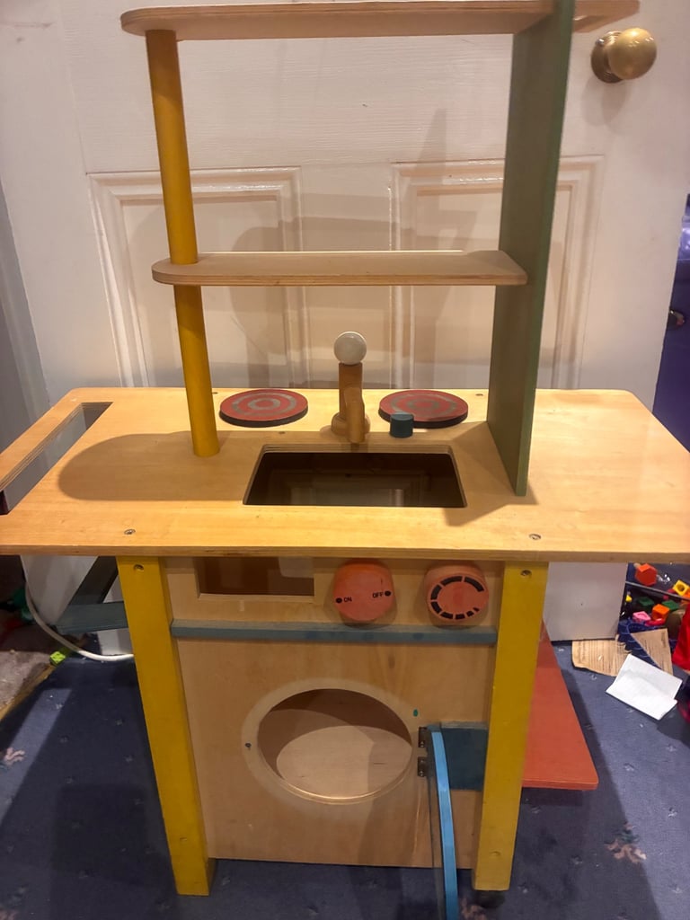 Lovely quality wooden toy play kitchen two sided to include cooker and washing machine used