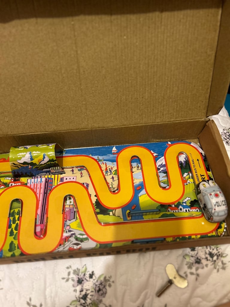 image for Tin police car and track.  Wind up with key 