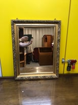  A large vintage 20th-century gilt wall hanging mirror. 