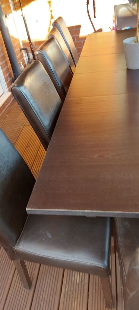 Large table and 12 brown chairs