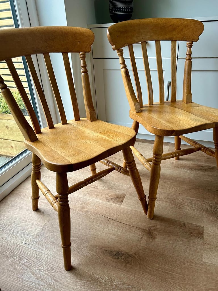 Solid oak dining table and four chairs