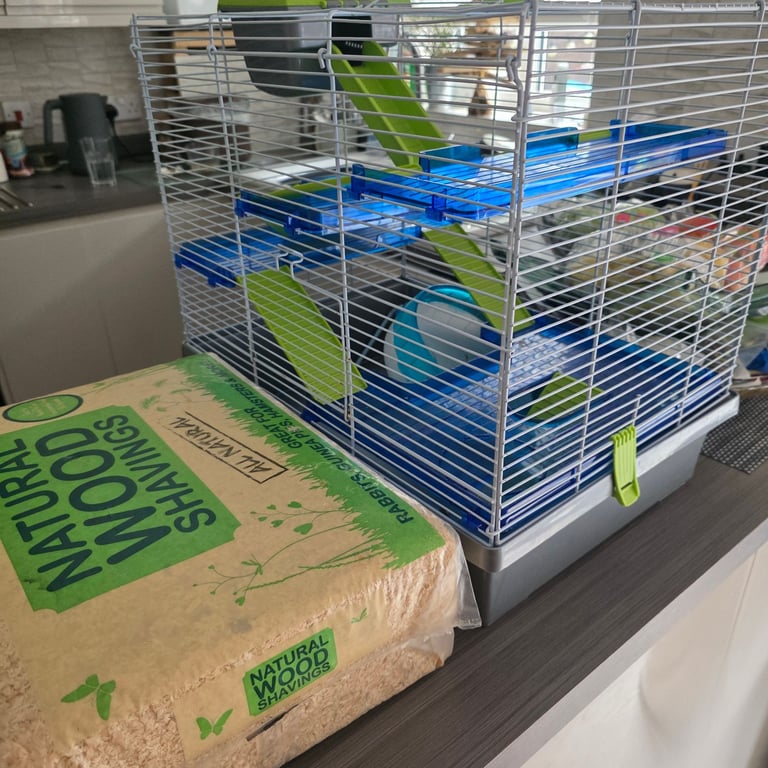 Large hamster cage with new wood chippings