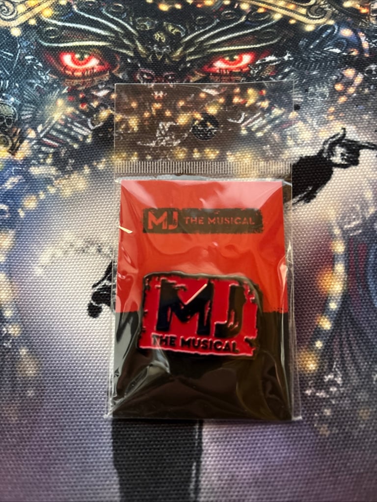 M j musical badge