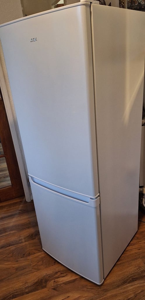 LOGIK fridge freezer size  H 142cm like new one year old 