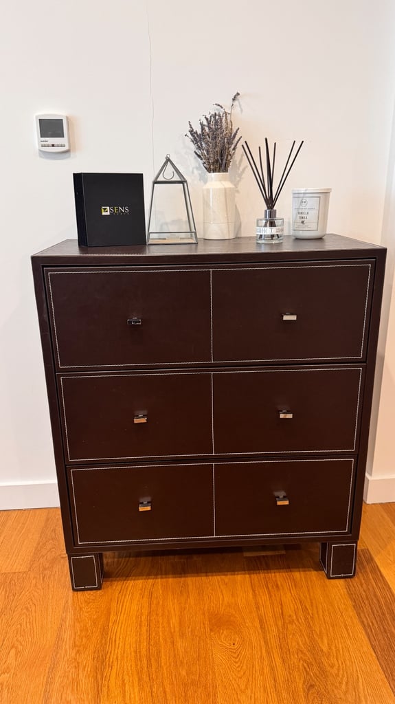 image for Brown faux leather chest of drawers with white stitching and three large drawers