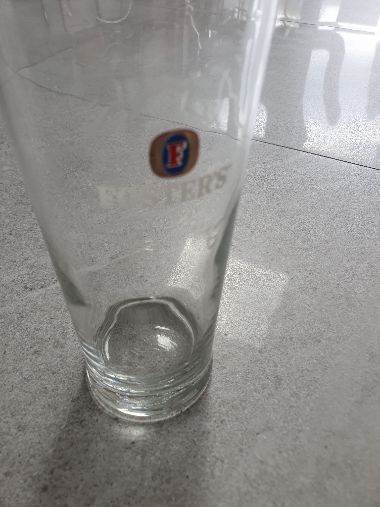 Embossed Fosters pint glass from 2000