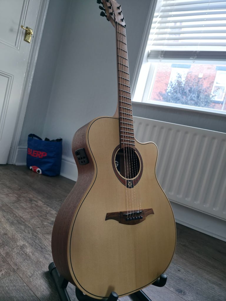 Electro Acoustic Guitar with stand, plectrums, capo included - Barely Used!