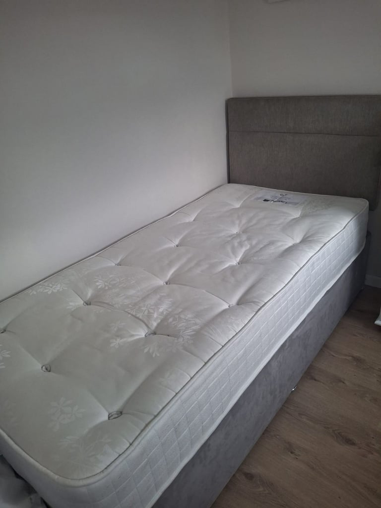 Single bed with mattress and headboard