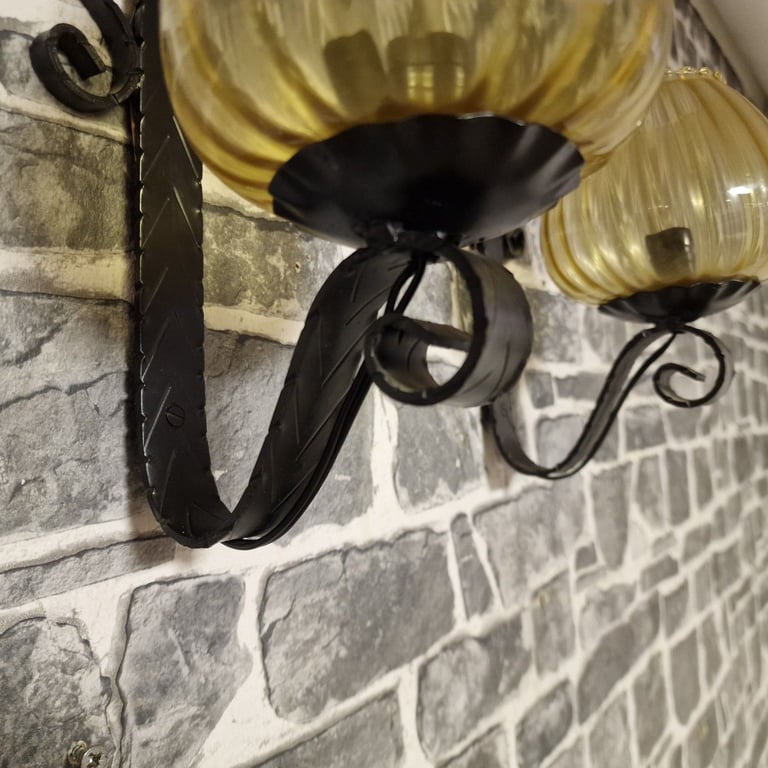 Pair of Vintage Wrought Iron Wall Sconces with Amber Glass Shades