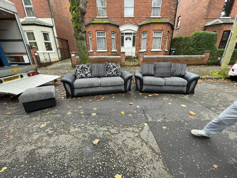 3 and 2 seater sofa in a black land grey fabric and leather couple of wee marks only £245