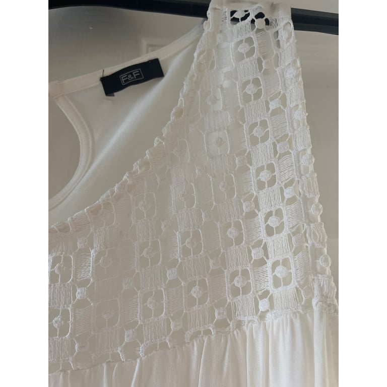 White sleeveless top
