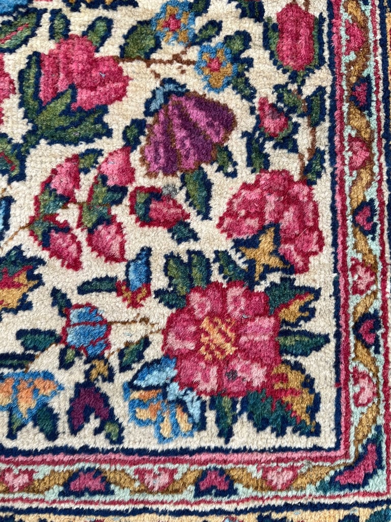 A pair of Antique Kirman mats 