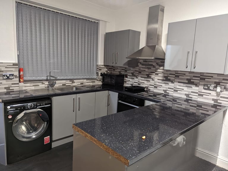 Room with separate kitchen. 