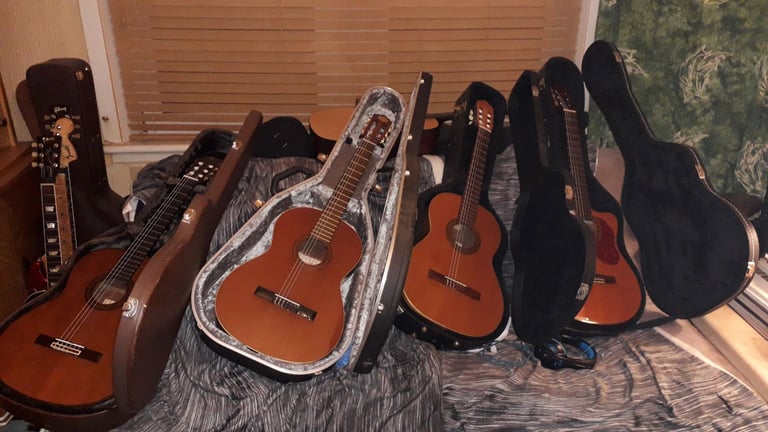 FOUR  handmade classical guitars including hard case 