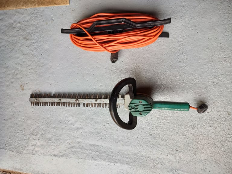 Black & Decker electric hedge trimmer & cable.
