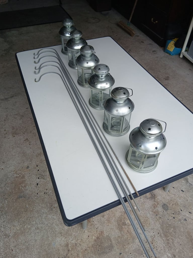 Six garden lanterns with six metal stakes