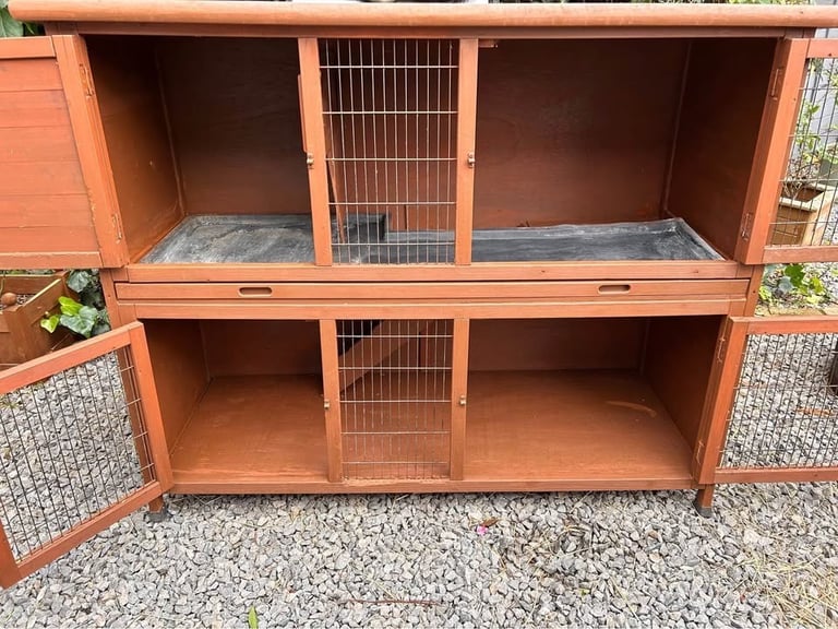 4ft “9 double guinea pig hutch with scratch and Newton rain cover. 