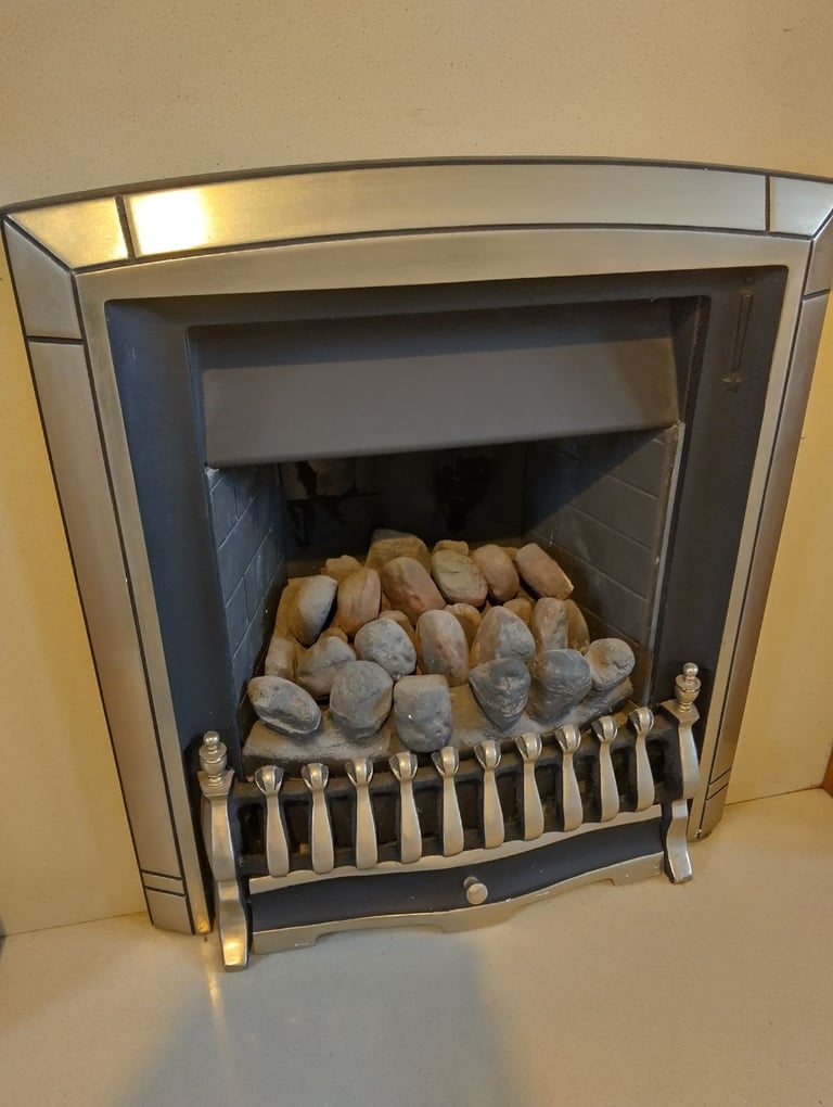 Gas fire with hearth and wood surround