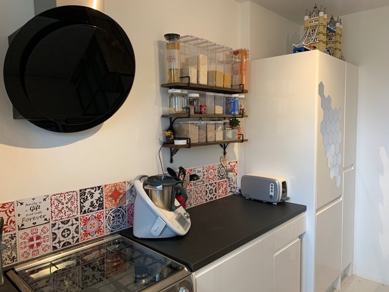 Modern and stylish black circular glass hood from Cooke & Lewis