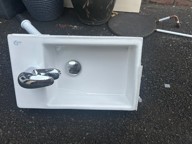 Small basin with tap and waste