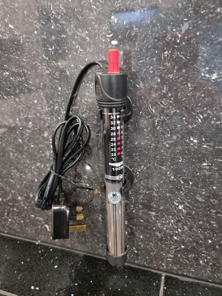 Fluval U4 underwater filter, thermometer and faux stone decoration