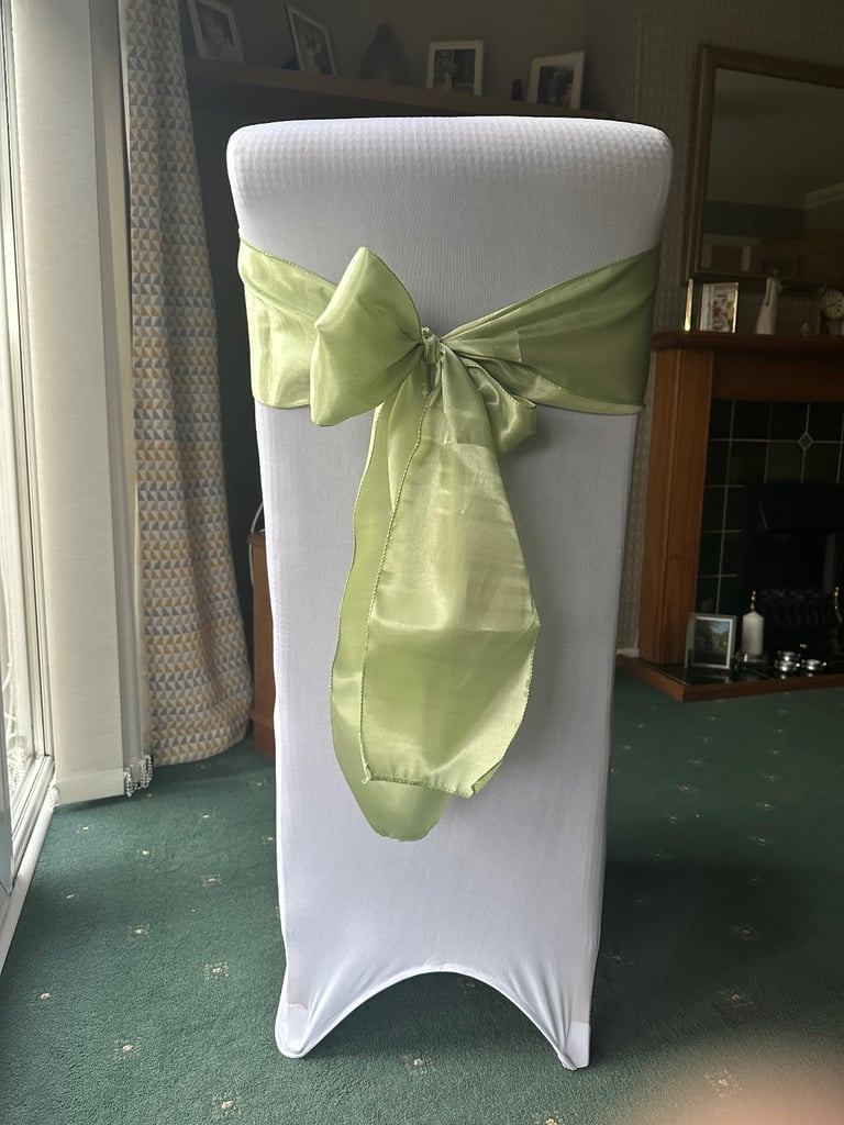 Wedding party chair covers and green sashes. 60 pieces