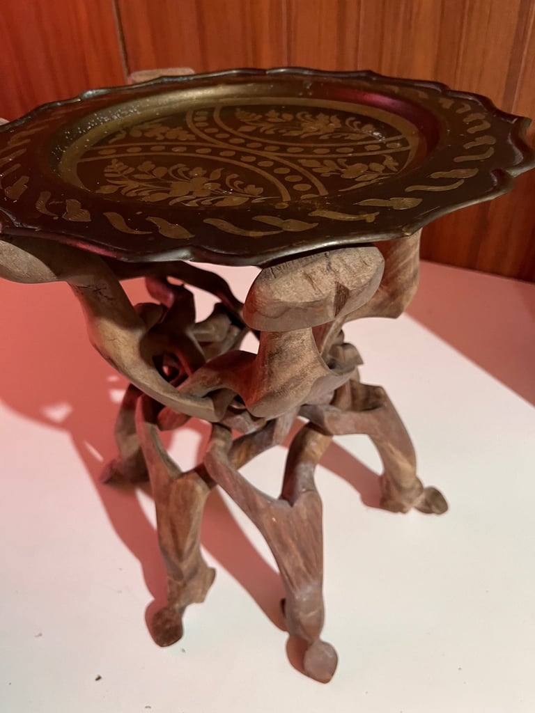 Hand carved wooden table/brass plate