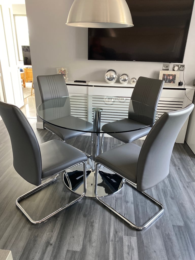 image for Circular glass dining table and four chairs SOLD PENDING COLLECTION ON FRIDAY 