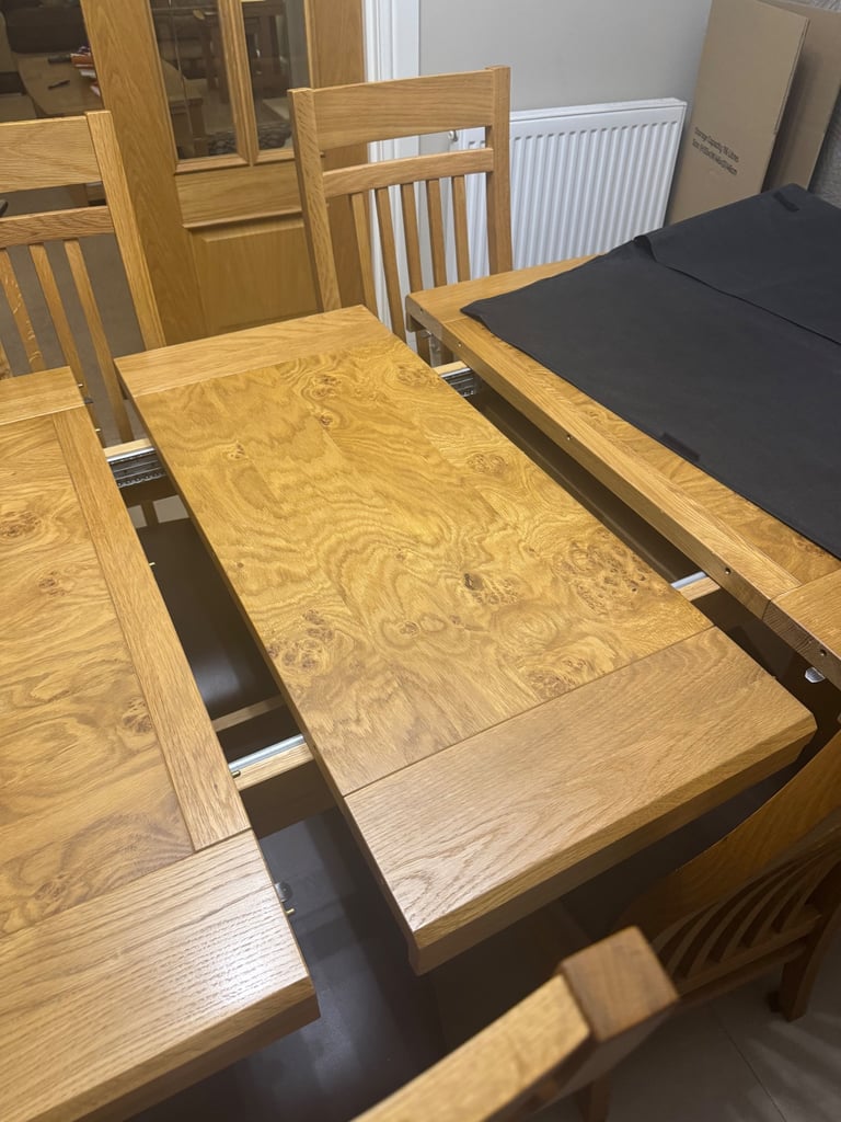 Extending Oak Dining Table with 8 matching chairs