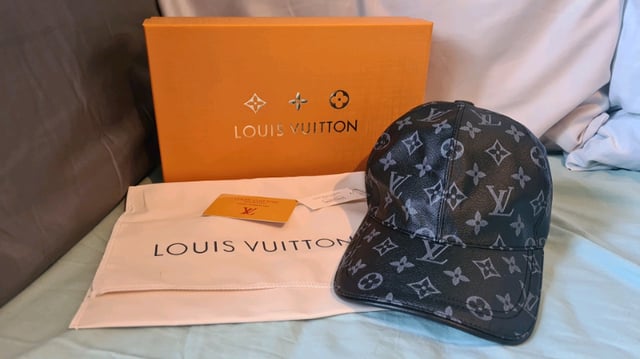 Louis Vuitton cap, with box and dust bag in black, in Elgin, Moray
