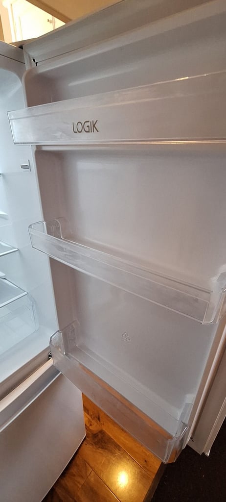 LOGIK fridge freezer size  H 142cm like new one year old 