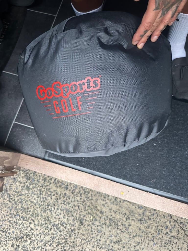 Filled golf impact bag as new