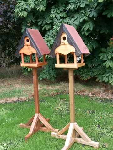 Locally made wooden bird tables with nesting boxes in Armagh