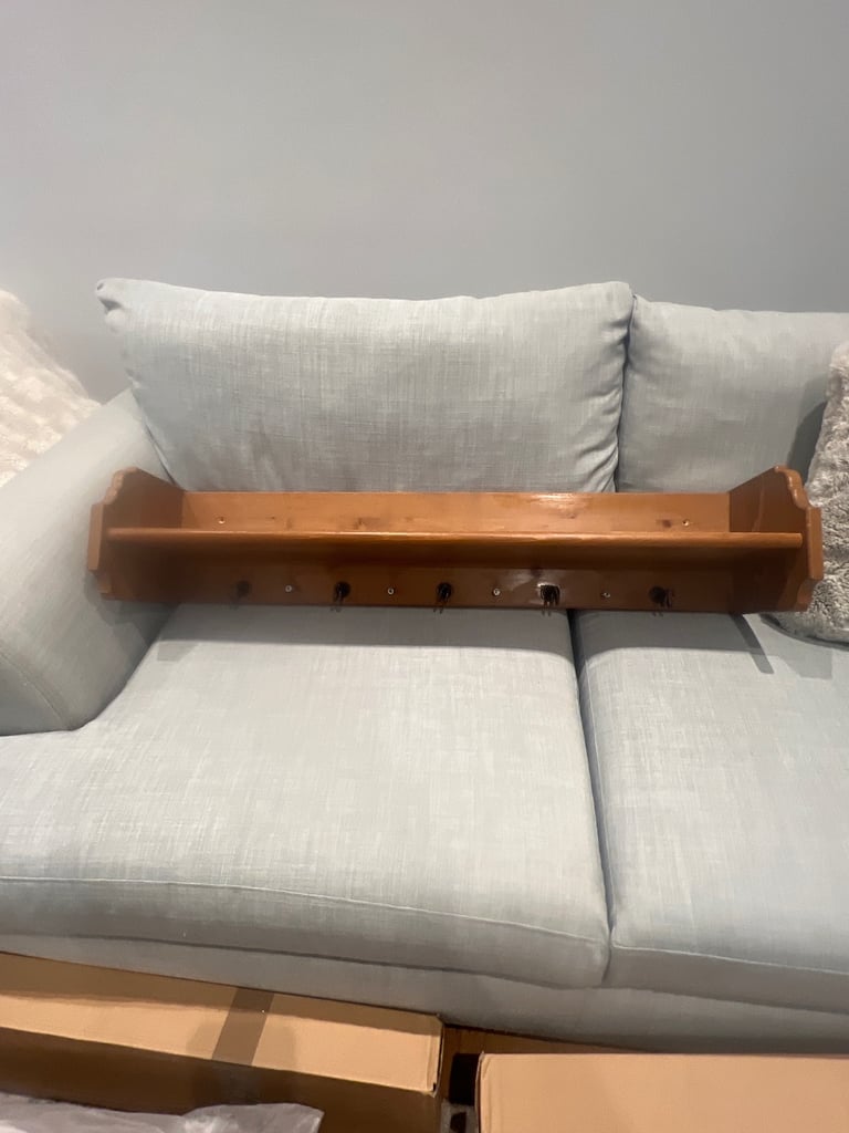 Pine shelf with hooks.  