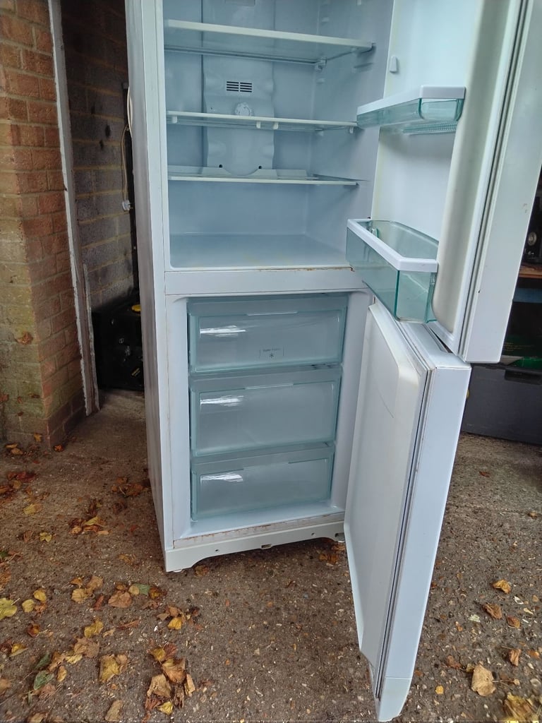 Hotpoint Fridge freezer 5ft x 9 inch high has couple of marks but all working can deliver local 