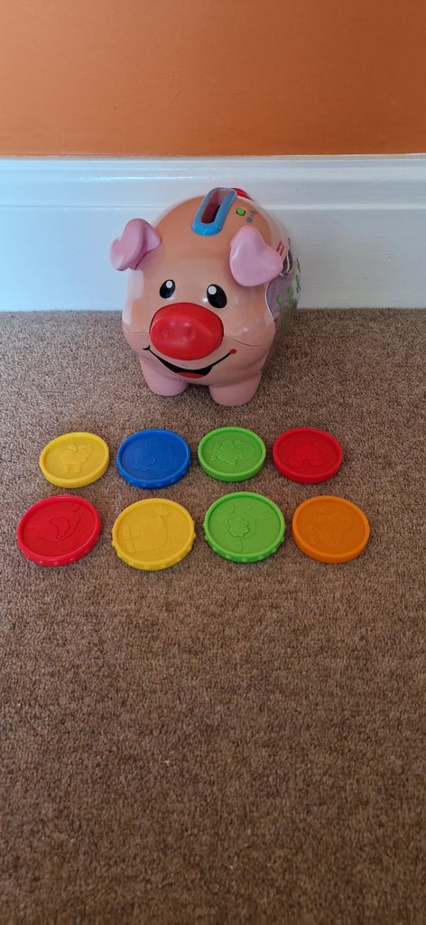 FISHER PRICE LAUGH AND LEARN COUNTING PIG. INCLUDES BATTERIES.