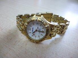 Beautiful women's gold Ellesse quartz watch with matching original strap,perfect working...