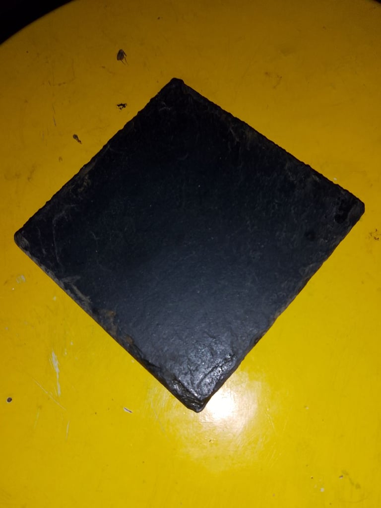 The Slate company coasters and candle stand